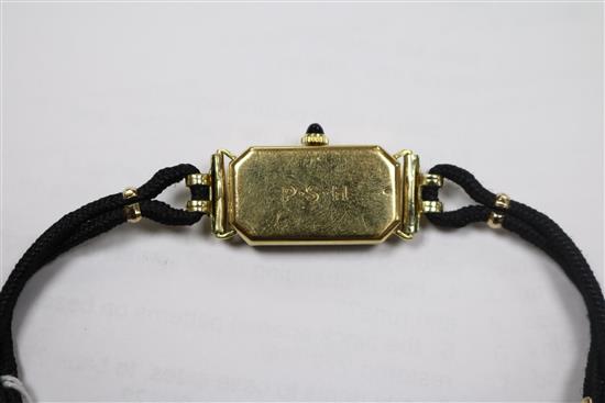 A ladys 18ct gold Longines manual wind wrist watch retailed by Tiffany & Co, on fabric strap.
